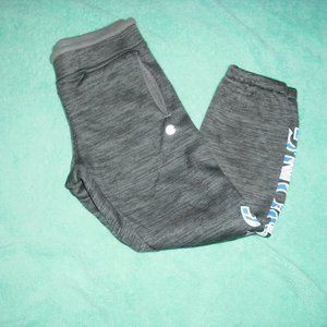 grey joggers with strong on the side